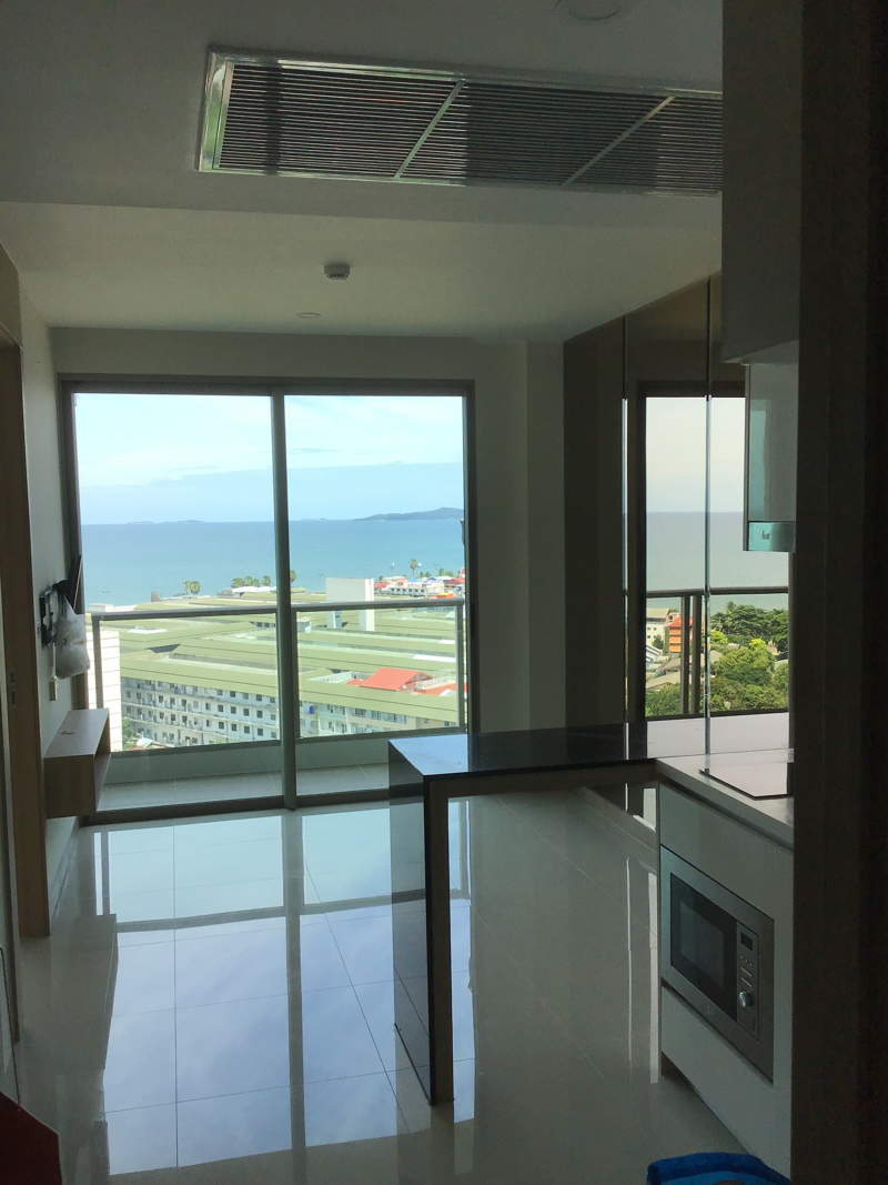 1 bed Condo near  Jomtien Beach view from the rooftop .Riviera Jomtien  a full range of facilities , such as a children's playground, rooftop pool with sunbeds, and a communal gym,
