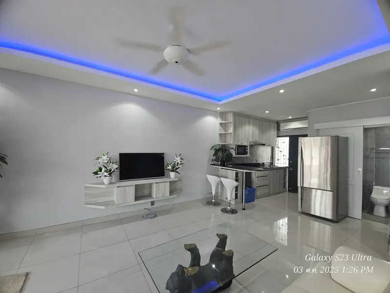2 bed condo near Jomtien Beach with 3 swimming pools, 2 tennis courts, 2 sauna rooms, a fitness center, a playground, restaurants, and laundry service.