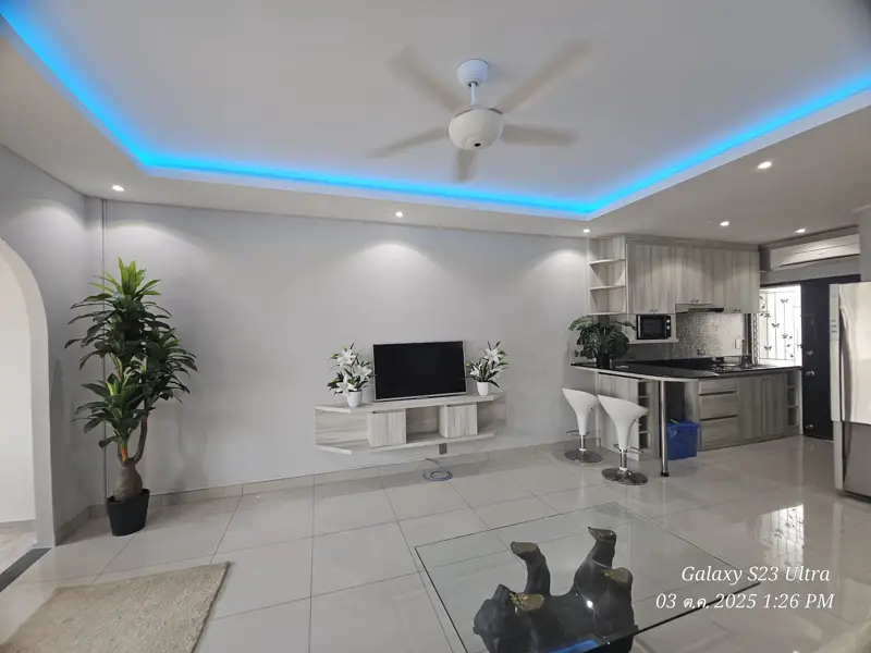 2 bed condo near Jomtien Beach with 3 swimming pools, 2 tennis courts, 2 sauna rooms, a fitness center, a playground, restaurants, and laundry service.