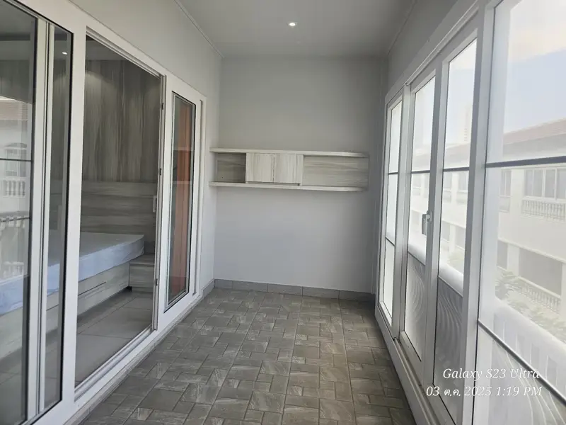 2 bed condo near Jomtien Beach with 3 swimming pools, 2 tennis courts, 2 sauna rooms, a fitness center, a playground, restaurants, and laundry service.