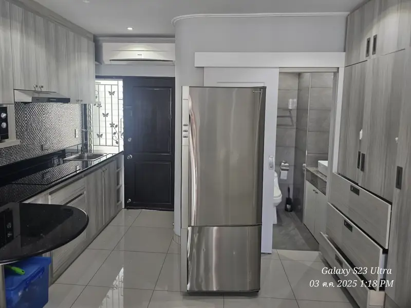 2 bed condo near Jomtien Beach with 3 swimming pools, 2 tennis courts, 2 sauna rooms, a fitness center, a playground, restaurants, and laundry service.