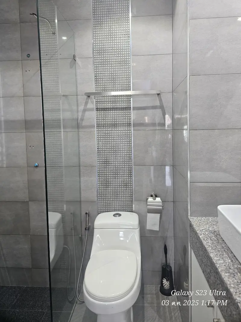 2 bed condo near Jomtien Beach with 3 swimming pools, 2 tennis courts, 2 sauna rooms, a fitness center, a playground, restaurants, and laundry service.