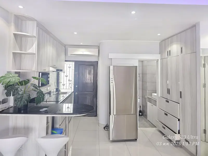 2 bed condo near Jomtien Beach with 3 swimming pools, 2 tennis courts, 2 sauna rooms, a fitness center, a playground, restaurants, and laundry service.