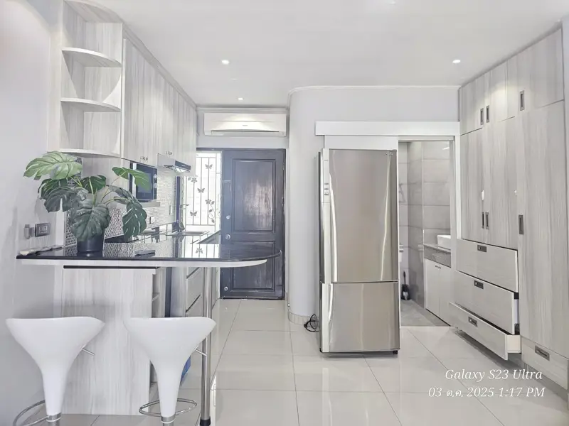 2 bed condo near Jomtien Beach with 3 swimming pools, 2 tennis courts, 2 sauna rooms, a fitness center, a playground, restaurants, and laundry service.
