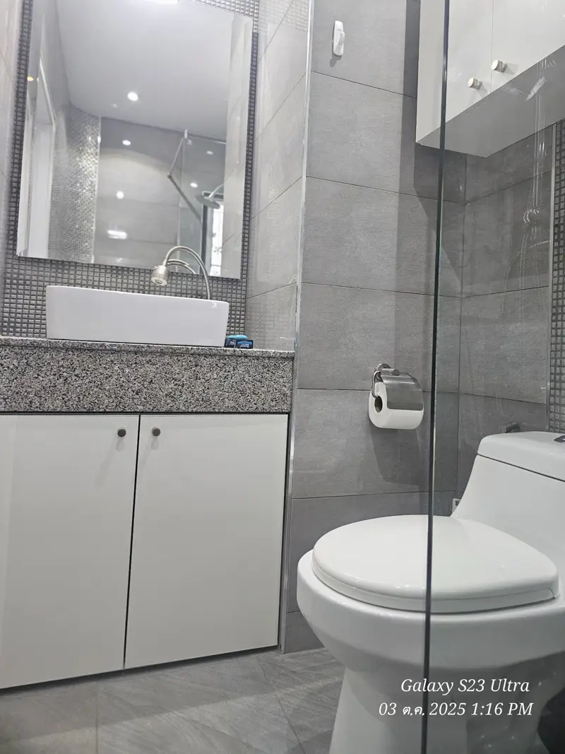 2 bed condo near Jomtien Beach with 3 swimming pools, 2 tennis courts, 2 sauna rooms, a fitness center, a playground, restaurants, and laundry service.