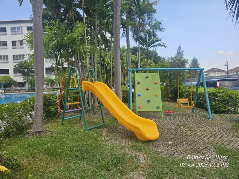 2 bed condo near Jomtien Beach with 3 swimming pools, 2 tennis courts, 2 sauna rooms, a fitness center, a playground, restaurants, and laundry service.