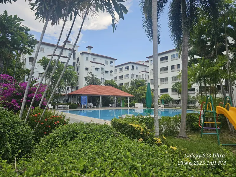 2 bed condo near Jomtien Beach with 3 swimming pools, 2 tennis courts, 2 sauna rooms, a fitness center, a playground, restaurants, and laundry service.