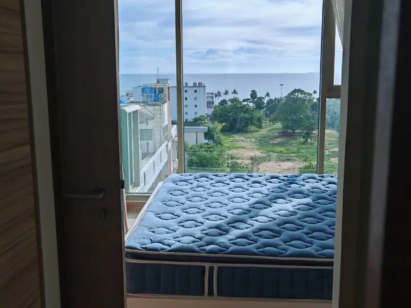 1 bed Condo near Jomtien Beach with children's playground, rooftop pool with sunbeds, and a communal gym, allowing commune overlooking sea view.