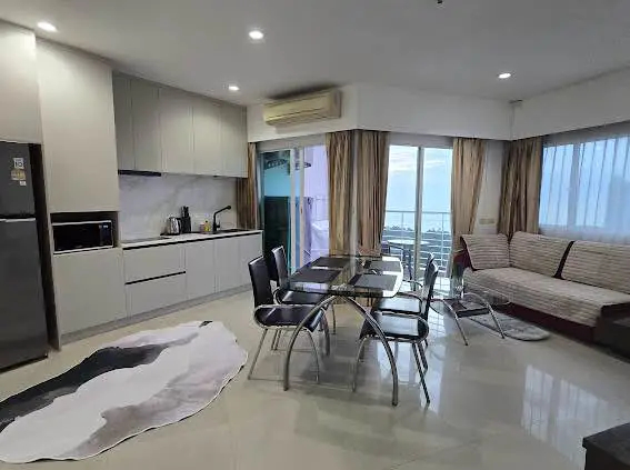  1 bed sea view condo Wongamat with facilities such as a swimming pool, fitness center, BBQ area, and on-site restaurant.