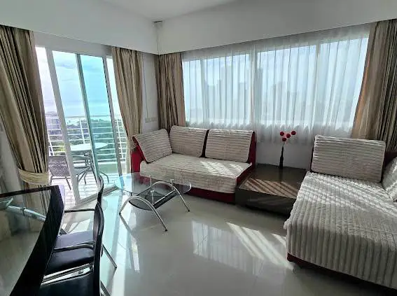  1 bed sea view condo Wongamat with facilities such as a swimming pool, fitness center, BBQ area, and on-site restaurant.