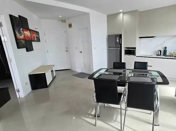  1 bed sea view condo Wongamat with facilities such as a swimming pool, fitness center, BBQ area, and on-site restaurant.