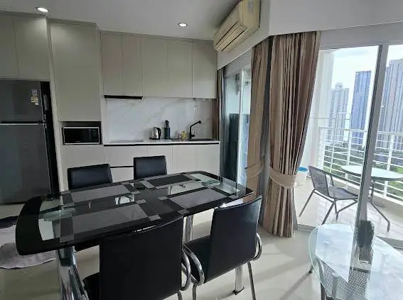  1 bed sea view condo Wongamat with facilities such as a swimming pool, fitness center, BBQ area, and on-site restaurant.