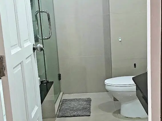  1 bed sea view condo Wongamat with facilities such as a swimming pool, fitness center, BBQ area, and on-site restaurant.