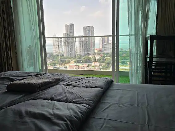  1 bed sea view condo Wongamat with facilities such as a swimming pool, fitness center, BBQ area, and on-site restaurant.