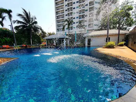  1 bed sea view condo Wongamat with facilities such as a swimming pool, fitness center, BBQ area, and on-site restaurant.