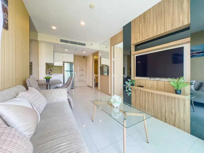 Riviera Wong Amat 1 Bedroom for sale luxury facilities including multiple swimming pools (including infinity edge sky pools), a fully-equipped gym, gardens, a kids' club, games room, 24-hour security