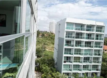 Luxury resort style condo for sale  Wongamat  with 1,000 square meter tropical lagoon pool Lush tropical gardens, boardwalks, waterslide Direct access to Wong Amat beach