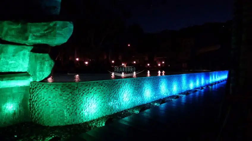 Unixx Condo swimming pool by night