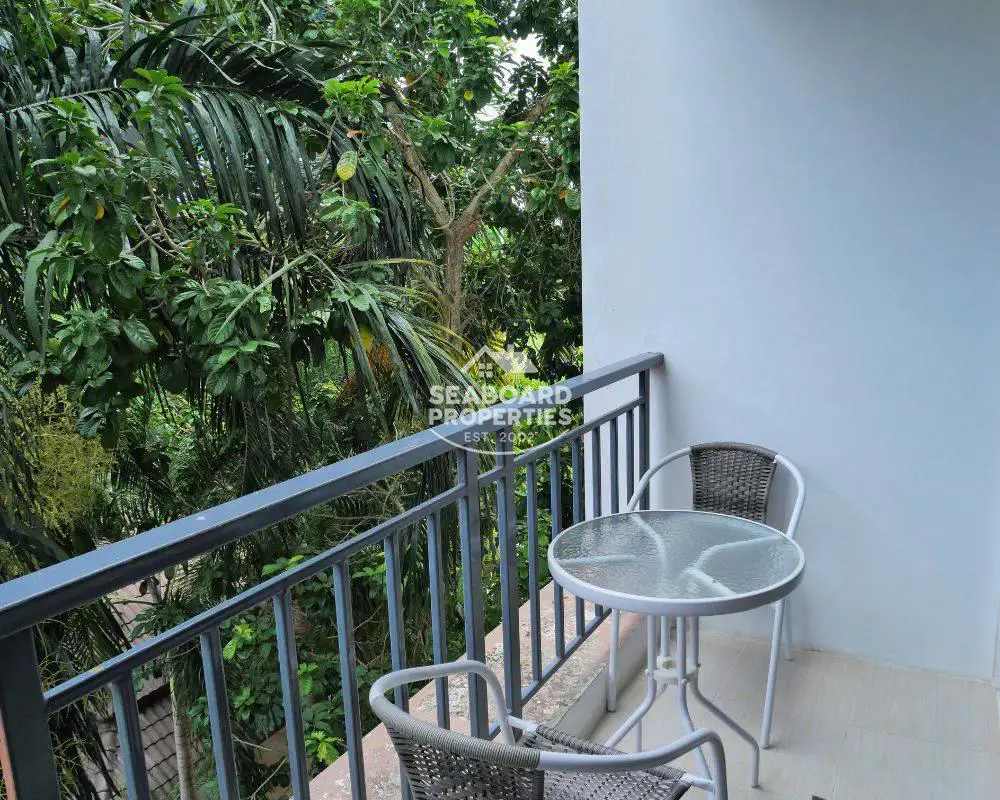 A.D. Lake and Resort Condominium for Rent in Bangsaray Pattaya - Private Balcony Seating with Garden View
