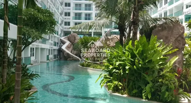Amazon Residence Condominium Jomtien Pattaya Tropical Resort Pool Deck with Wooden Bridge