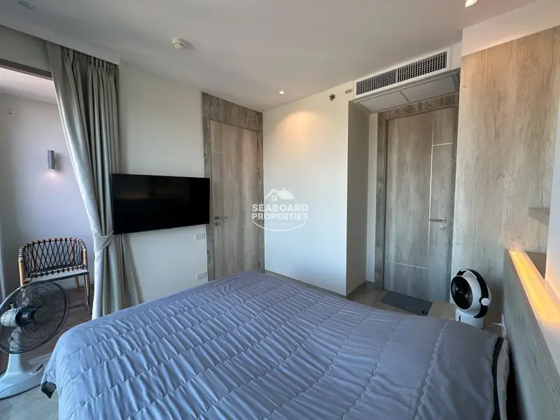 The Riviera Monaco Na Jomtien Cozy Bedroom Interior & Wall-Mounted TV