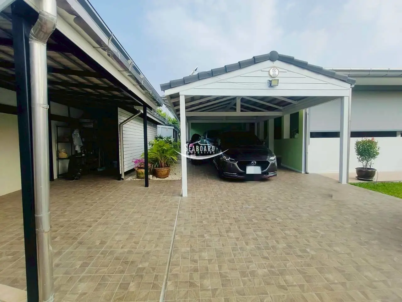 Secure Covered Double Carport & Elegant Entrance