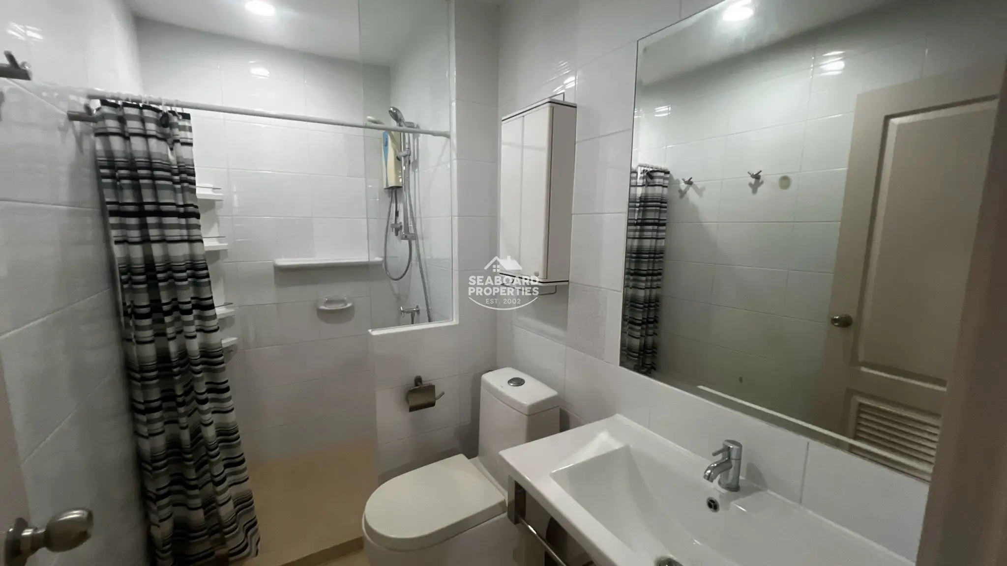 Unicca Condominium Shower Enclosure Bathroom Area