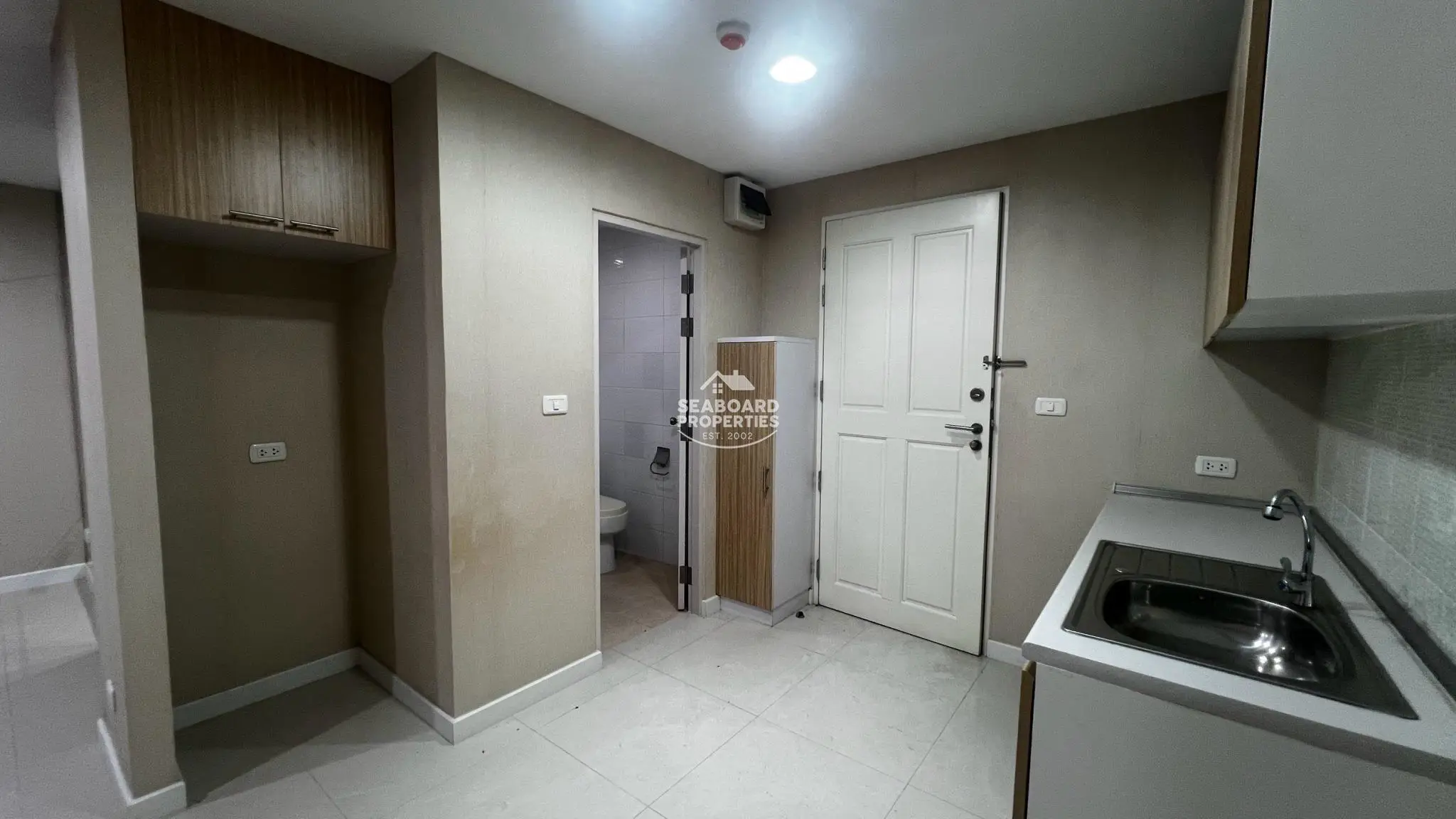 Unicca Condominium Room Entrance and Built-in Cabinetry