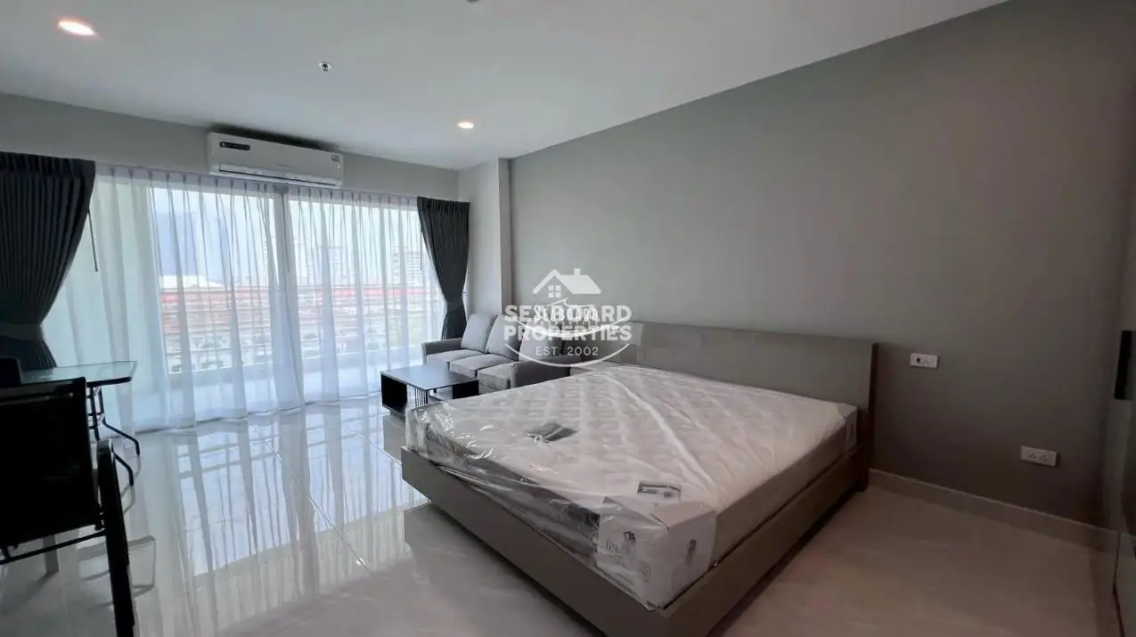 View Talay 5 D Condominium Jomtien Modern Studio Double Bed & Seating Area | Retirement Condo Pattaya