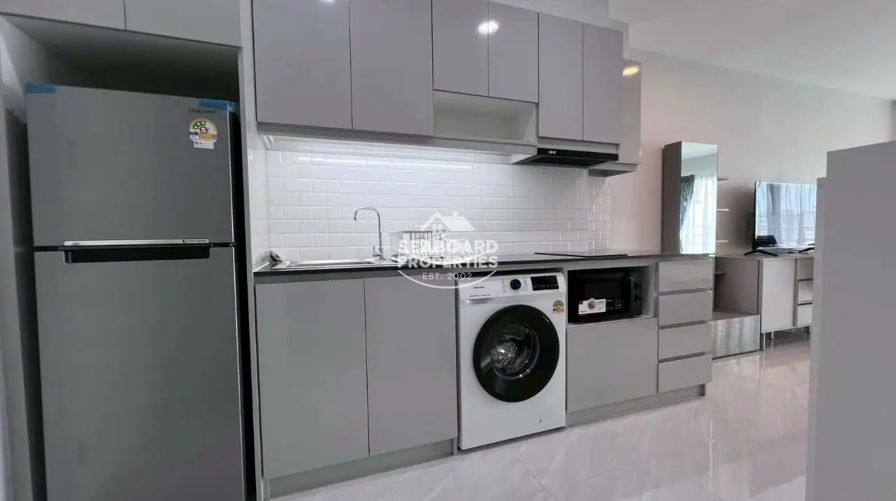 View Talay 5 D Condominium Jomtien Kitchenette Countertop & Washing Machine Setup | Condo for Sale & Rent