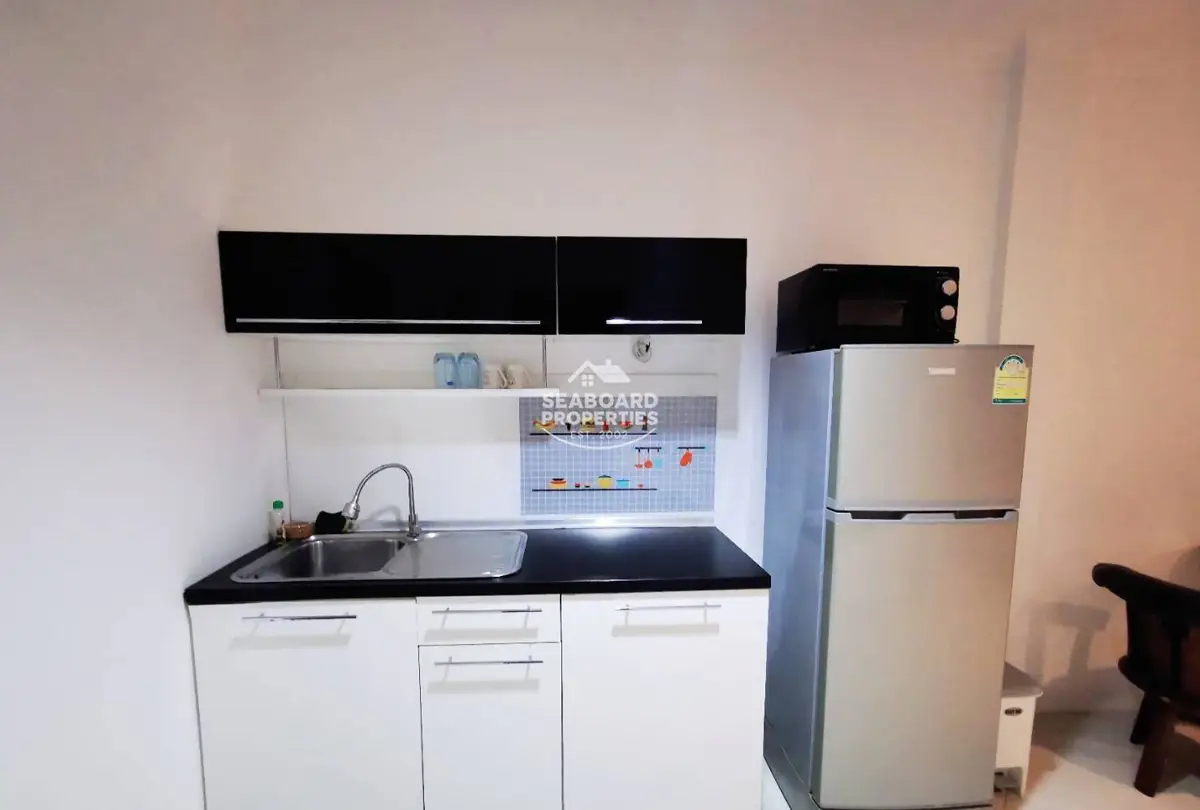 View Talay 6 Condominium - Living Room with Sofa & Air Conditioning