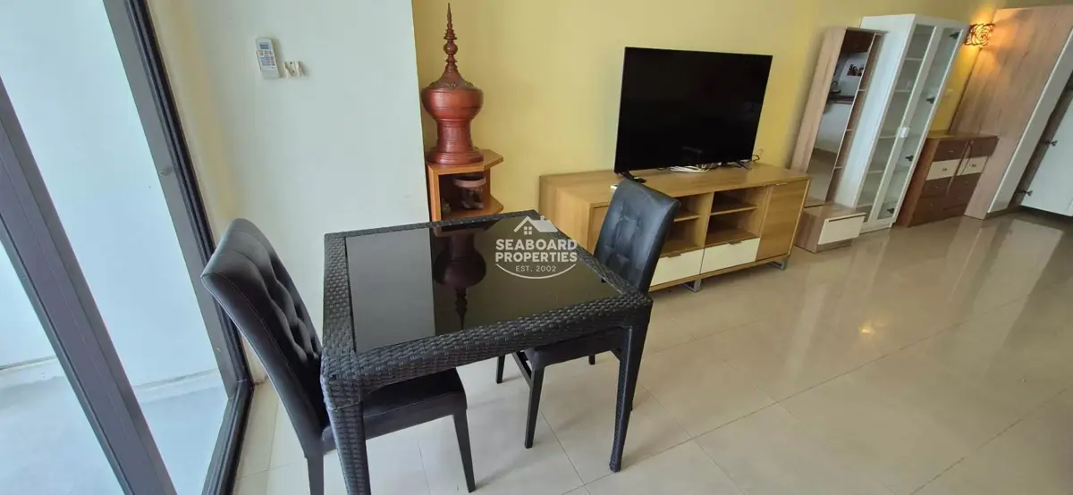 Jomtien Complex Condominium Dining Table Area & Living Room View
