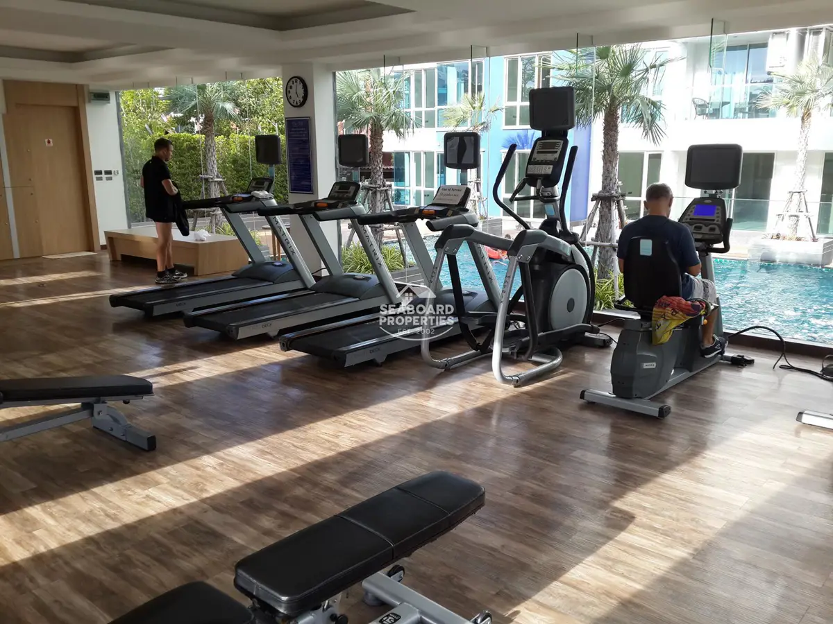 The Cliff Residence Fully Equipped Fitness Center Overlooking the Pool